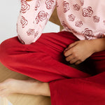Red Sweatpants and Rose Long Sleeve Shirt